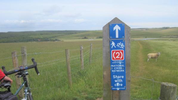 Cycle route NCN2 signpost in fields near Seaford