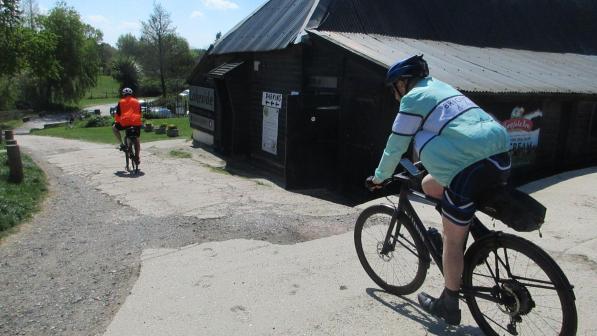 Cyclists riding downhill at Lakeside cafe