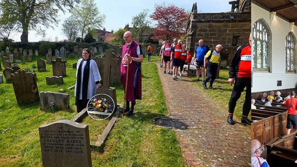 (Left) Rector Liz Hassall and the 'Biking Bishop of Selby' John Thomson with a bicycle-wheel floral tribute at St Michael’s (Right) Cyclists inside St Michael's Church