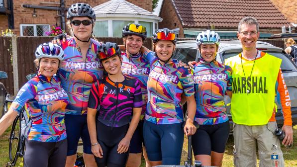 Elle stands with her teammates and one of the organisers at Seacroft Wheelers Road Race. She is fifth from the left, third from the right. She is wearing Klatsch club cycle kit. 