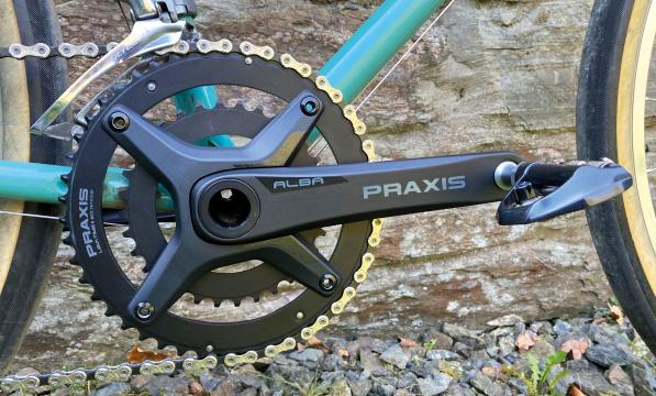 A close-up of the Alba Praxis chainset on a bike