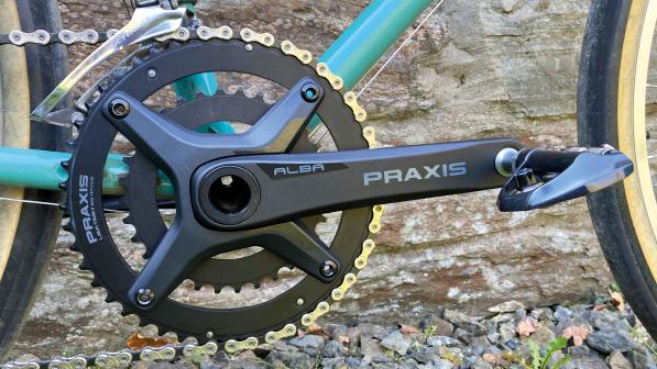A close-up of the Alba Praxis chainset on a bike