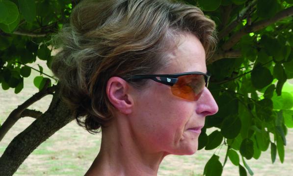 A woman's profile showcases a pair of sunglasses