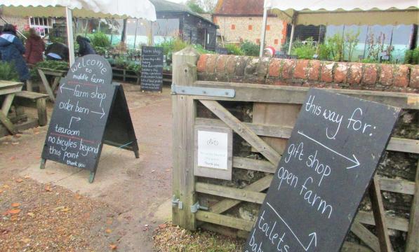 The courtyard at Middle Farm with blackboards giving directions