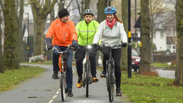 Cyclists riding along a cycle lane