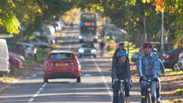 Cyclist riding along a cycle lane in Norwich