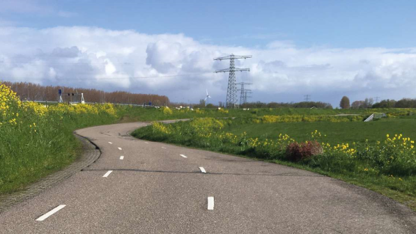 Scenic photo of a road in the Netherlands with no cars or people on it