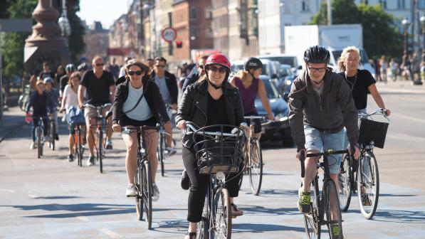 Group of cyclists together on the road in Copenhagen (c) Flickr/Martti Tulenheimo