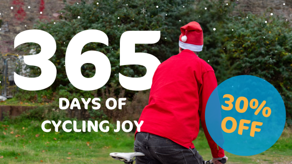 An image of someone cycling wearing a santa hat cycling away. The overlaid text reads '365 days of cycling joy, with 30% off'