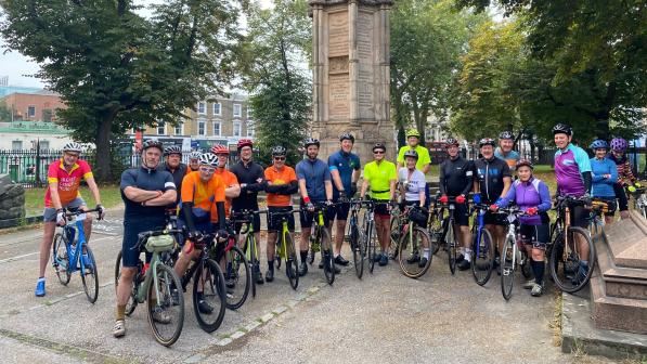 Group of cyclists posing together as they take part in the London to Amsterdam cycle challenge