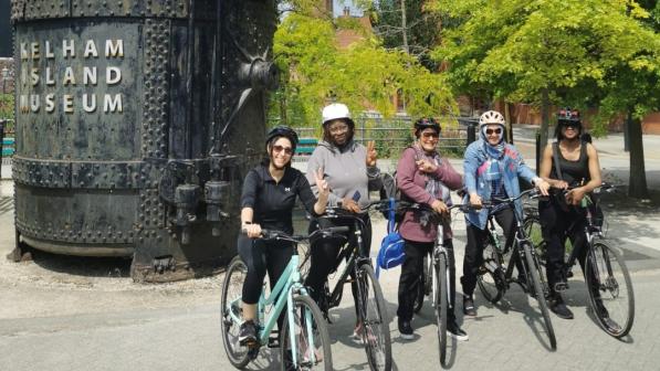 Group of women standing together with their bikes