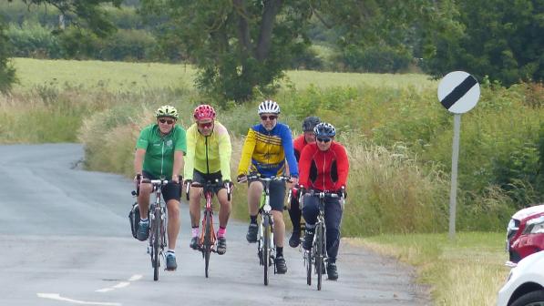 Four Gainsborough Aegir Cycule Club members enjoying a ride on a quiet country road