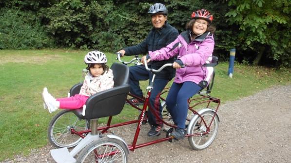 Sophia and her family on an adapted cycle